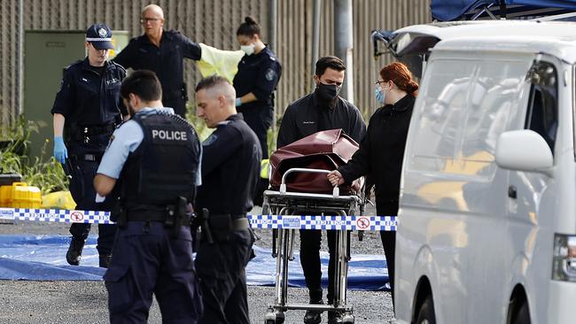 Police remove Mohammed Chami’s body from the crime scene. Picture: Tim Hunter