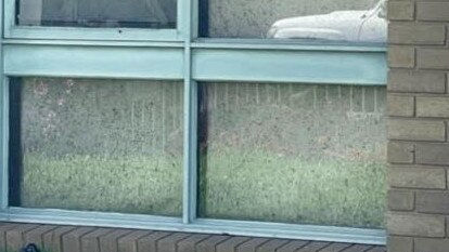 A picture of black mould on the windows of the Newtown unit sent to DFFH in 2022.