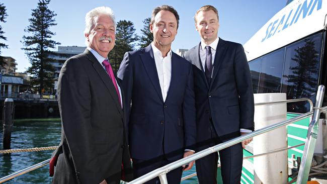 James Griffin (right) pictured with bosses of Captain Cook Cruises back in 2017. The Manly MP helped get Manly Fast Ferry to take on the service on a short-term basis. Picture: Adam Yip