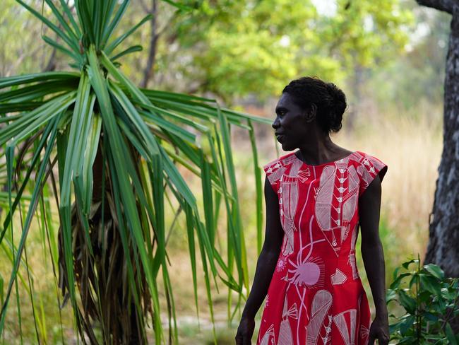 Djenj (Fish) fabric by Isaiah Nagurrgurrba has been created into a pleated dress by Michele Truscott