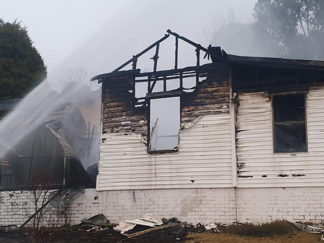 Shocking images captured the aftermath of a fire in southern NSW that could have been deadly if not for the heroic act of a passer by. Image: FRNSW