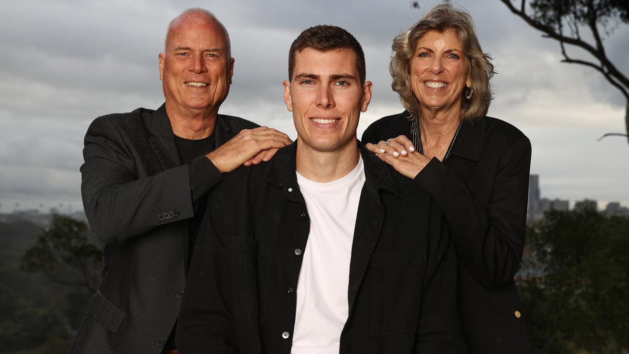 Collingwood big man Mason Cox and parents Phil and Jeanette. Pic: Michael Klein