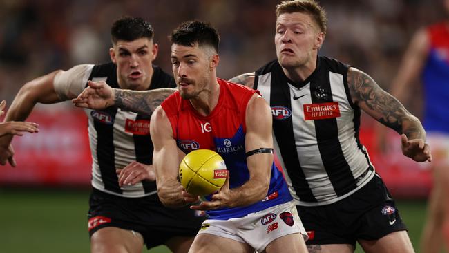 Jordan De Goey and Brayden Maynard close in on Alex Neal-Bullen. Picture: Michael Klein