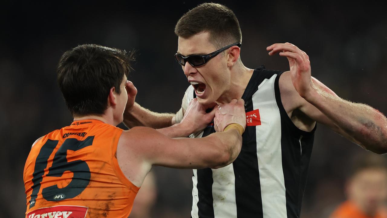 MELBOURNE, AUSTRALIA - SEPTEMBER 22: Mason Cox of the Magpies wrestles with Sam Taylor of the Giants after he scored a goal during the AFL First Preliminary Final match between Collingwood Magpies and Greater Western Sydney Giants at Melbourne Cricket Ground, on September 22, 2023, in Melbourne, Australia. (Photo by Robert Cianflone/AFL Photos/via Getty Images)