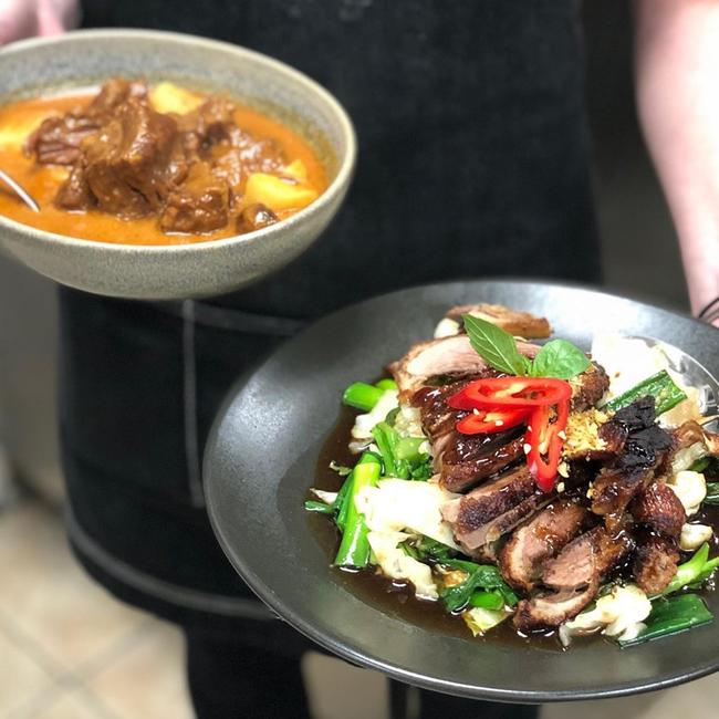 Slow cooked beef mussaman curry (left) and crispy roast duck (right) at Thai Tamarind.