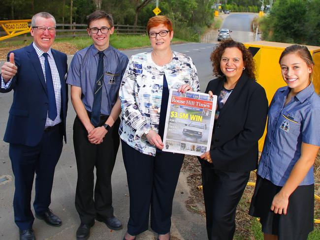 Rouse Hill Anglican College principal Peter Fowler, student Lachlan Moore, Defence Minister Marise Payne, Greenway MP Michelle Rowland and student Kaitlyn Smith with a copy of the Rouse Hill Times at last year’s announcement of the new bridge. Picture: Phil Rogers