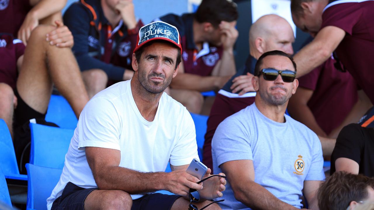 SHARKS V SEA EAGLES in a pre season NRL game at Pittwater Park in North Narrabeen today. Ex players and brothers Andrew (left) and Matthew Johns watch the game.