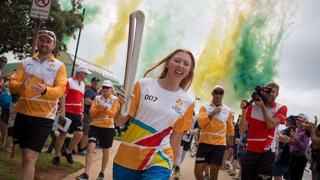 The Queen's Baton, carried by batonbearer Lakeisha Patterson, through Redcliffe.