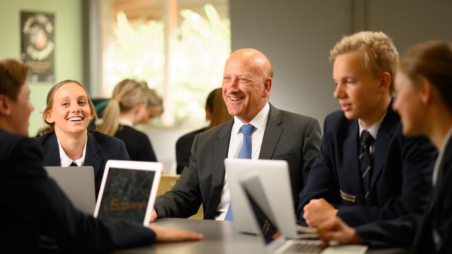 Principal Stuart Meade in class with Year 12 students at Matthew Flinders Anglican College.