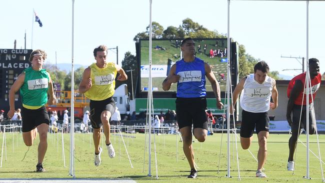 Dhruv Rodrigues Chico (blue) wins the 2019 Stawell Gift. Picture: AAP