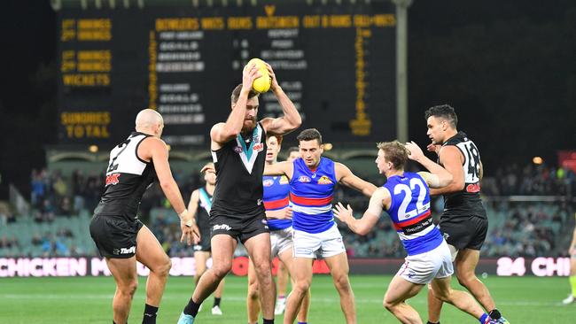 Charlie Dixon of the Power takes a strong mark agaainst the Western Bulldogs. Picture: AAP Image/David Mariuz