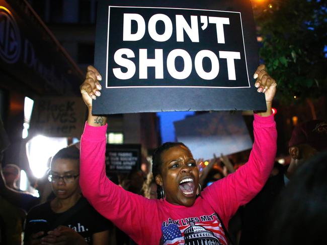 A woman holds a banner during a protest in support of the Black lives matter movement in New York on July 09, 2016. Picture: AFP PHOTO / KENA BETANCUR