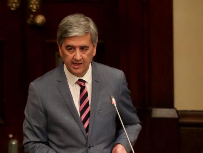 SA Treasurer Rob Lucas hands down his 2019/20 Budget papers at Parliament House in Adelaide, Tuesday, June 18, 2019. (AAP Image/Kelly Barnes) NO ARCHIVING