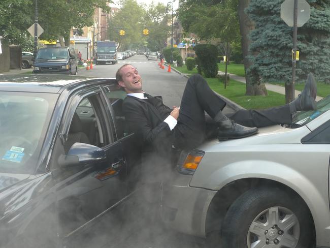 Stevenson enjoying sitting on two cars on set in America