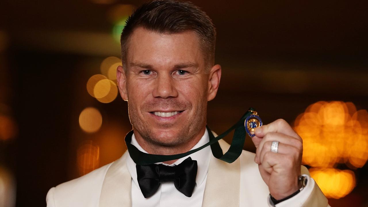 David Warner poses with the Allan Border Medal, the third time he’s won the honour.