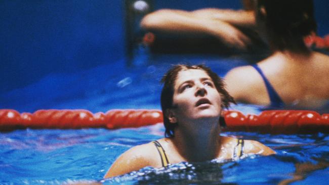 Dawn Fraser after claiming victory in the 100m freestyle event at the Tokyo Olympics. She won for the third consecutive time, in a time of 59.5 seconds.