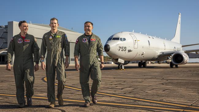 US Navy P-8A Poseidon aircrew, Lieutenants Ryan Mariano and Colin Woodman, alongside RAAF Flying Officer Neil Charman, centre, at RAAF Base Darwin during Exercise Talisman Sabre 23. Picture: Defence