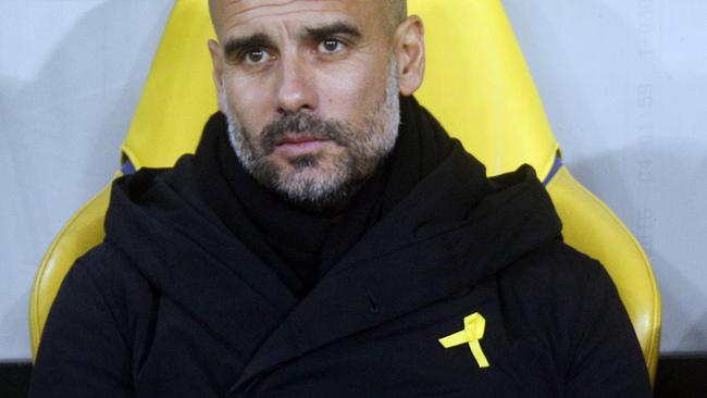 Manchester City coach Pep Guardiola wearing his yellow ribbon