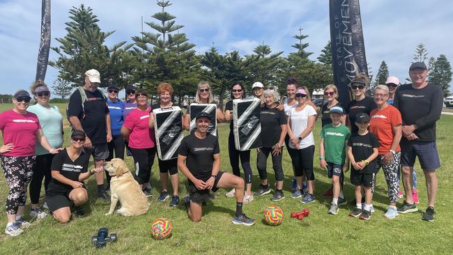 Shannon Barry (centre) with his loyal group of clients at Point Malcolm Reserve. Pic: Emily Jarvis