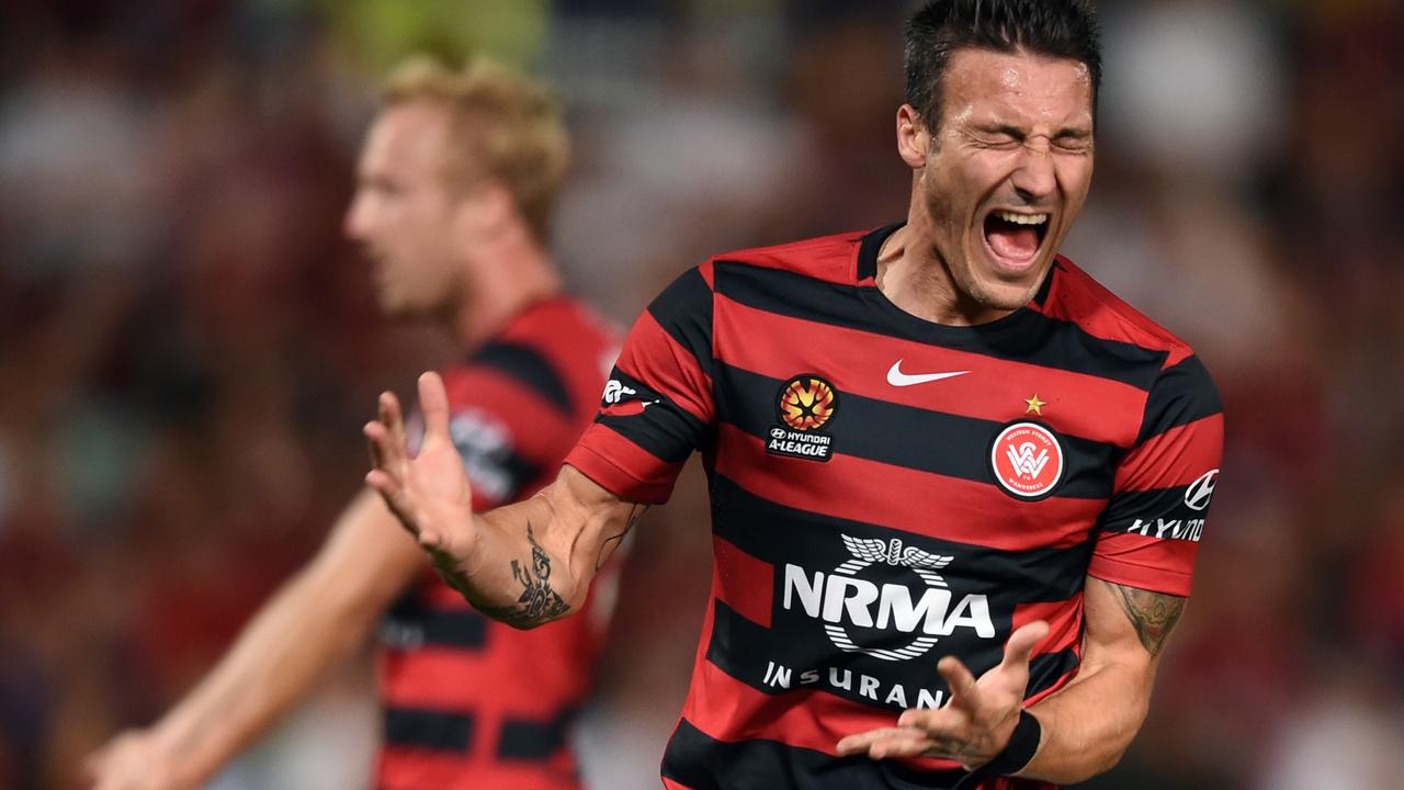 Federico Piovaccari (right) of the Wanderers reacts to a missed shot at goal during the round 13 A-League match between the Western Sydney Wanderers and Adelaide United at Pirtek Stadium on Friday, Jan. 1, 2016. (AAP Image/Paul Miller) NO ARCHIVING, EDITORIAL USE