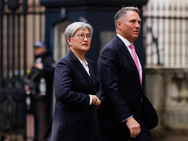 Australia's Foreign Minister Penny Wong (L) and Australia's Deputy Prime Minister and Defence Minister Richard Marles arrive at Lancaster House for the annual Australia-UK Ministerial Consultations (AUKMIN) meeting in London on December 16, 2024. (Photo by Dan Kitwood / AFP)