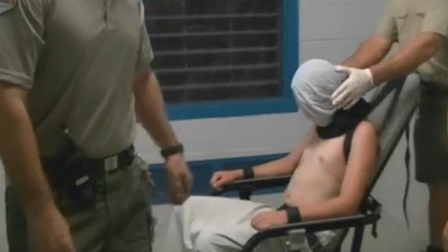 A screengrab from footage of the Don Dale Youth Detention Centre shows a boy strapped to a mechanical chair. Picture: ABC Four Corners/AAP