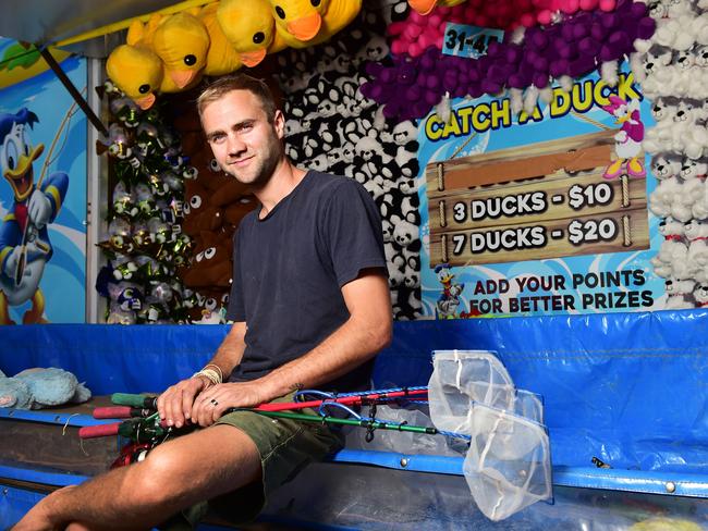 Jesse Smith sets up his Carnival Kingdom in preparation for the Townsville Show this weekend. Picture: Shae Beplate.