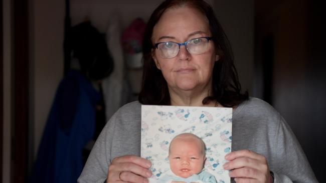 Julie-Ann Pope with a picture of her son Joshua who died 25 years ago. Picture: Tracey Nearmy