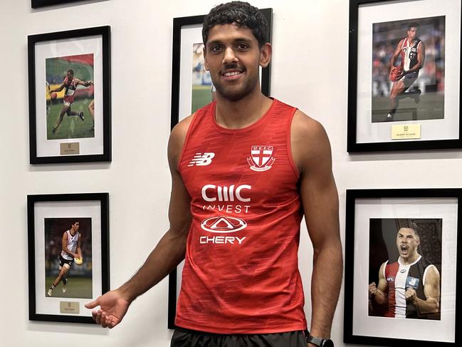 St Kilda’s Nasiah Wanganeen-Milera in the club’s Indigenous room at Milera. Among the pics is one of Nasiah’s father, Terry Milera, who also played for the Saints. Picture: Supplied