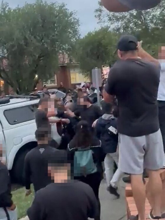 Three people have been charged after hundreds of people clashed outside a Belfield church.