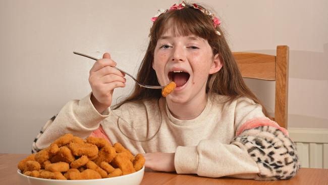 Jessica Thompson, 11, eating chicken nuggets for 10 years straight. Picture: Mercury Press/Caters News