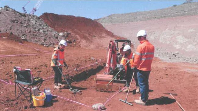 The Nexus team using a metal detector to locate coins from Hoard B in compacted soil.