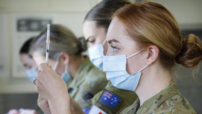 Private Jade Kinnear prepares of dose of vaccine. Picture: Picture Chris Pavlich