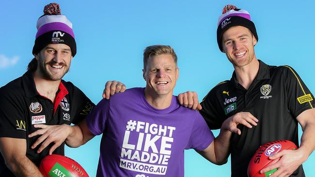 Josh Bruce (left) with Nick Riewoldt and Richmond’s David Astbury for Maddie’s Match. Picture: Ian Currie