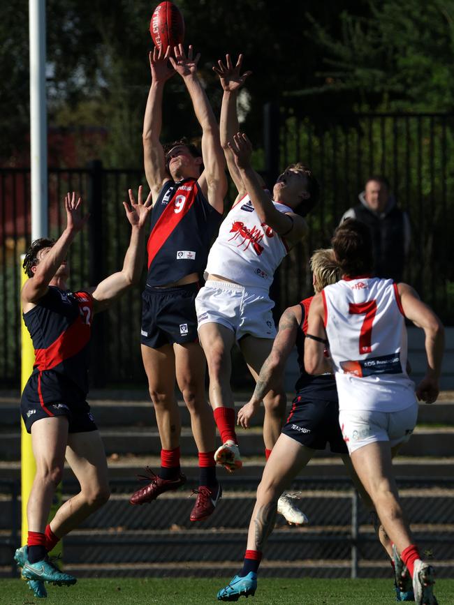 VFL: Coburg’s Ryan Sturgess flies highest. Picture: Hamish Blair