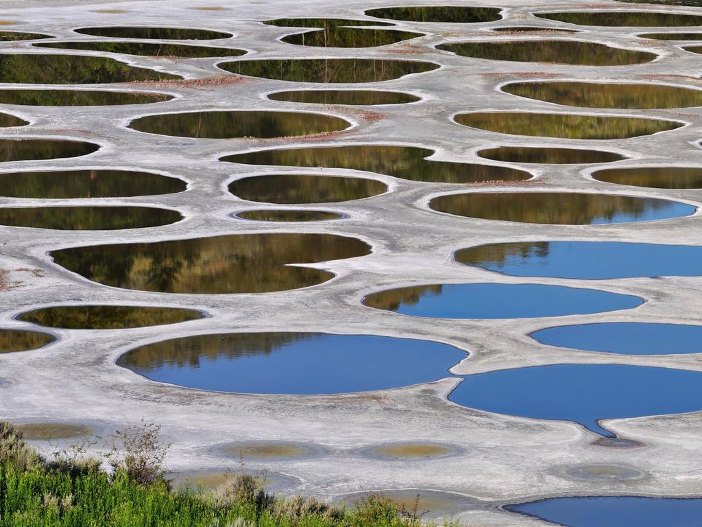 <span>15/20</span><h2>Spotted Lake, BC</h2><p> Situated 380km east of Vancouver in Osoyoos, Canada’s only true desert environment, <a href="https://www.hellobc.com/stories/the-magic-of-spotted-lake-in-osoyoos/" target="_blank">this bizarre lake </a>seems like a roadside mirage. However, it’s the result of mineral-rich water, much of which evaporates during the hot summer months, leaving behind a concentration of these minerals that form the lake’s ‘spots’. They even shift in size and colour throughout the warmer months as the mineral ratios change with further evaporation.</p>