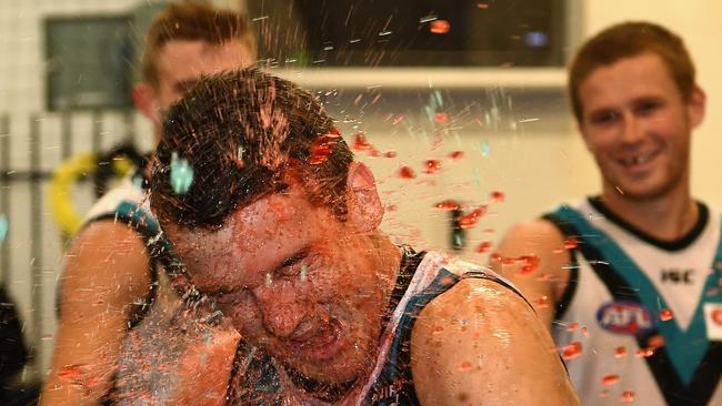 Jack Trengove cops a spray from teammates in his first game in Power colours as they celebrate in the rooms after their win against Carlton. Picture: Quinn Rooney/Getty Images)