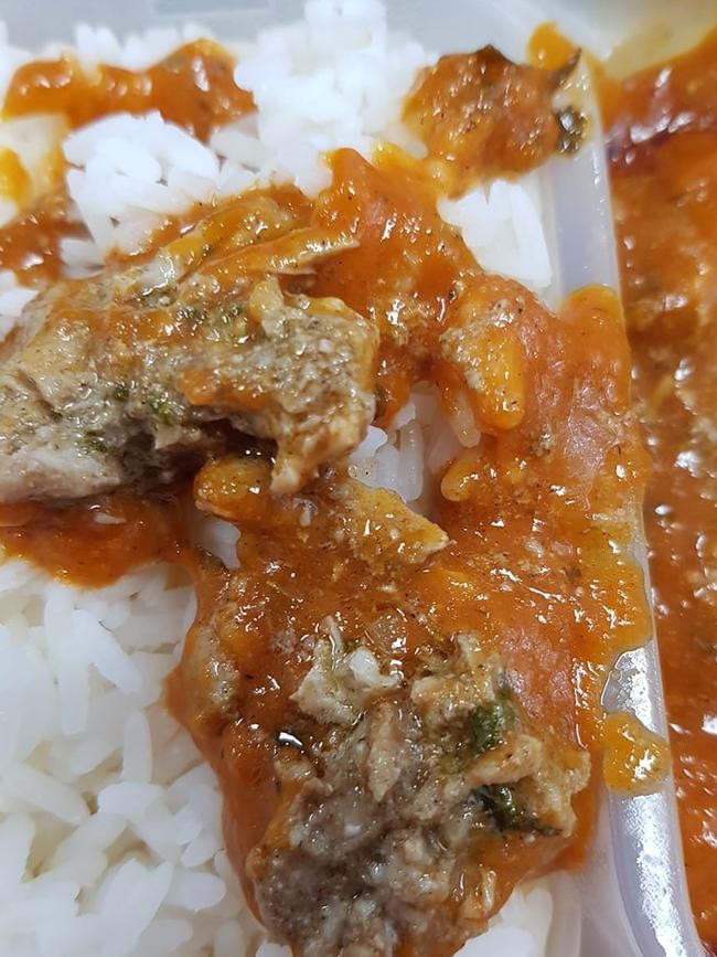 A shopper took to Facebook to reveal grey meat matter in his pre-made Woolworths Butter Chicken with Rice meal. Picture: Facebook