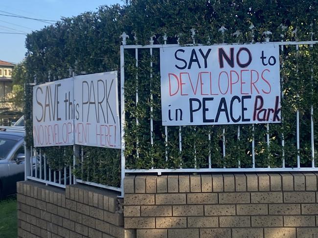 Save Peace Park signs posted around Ashbury.