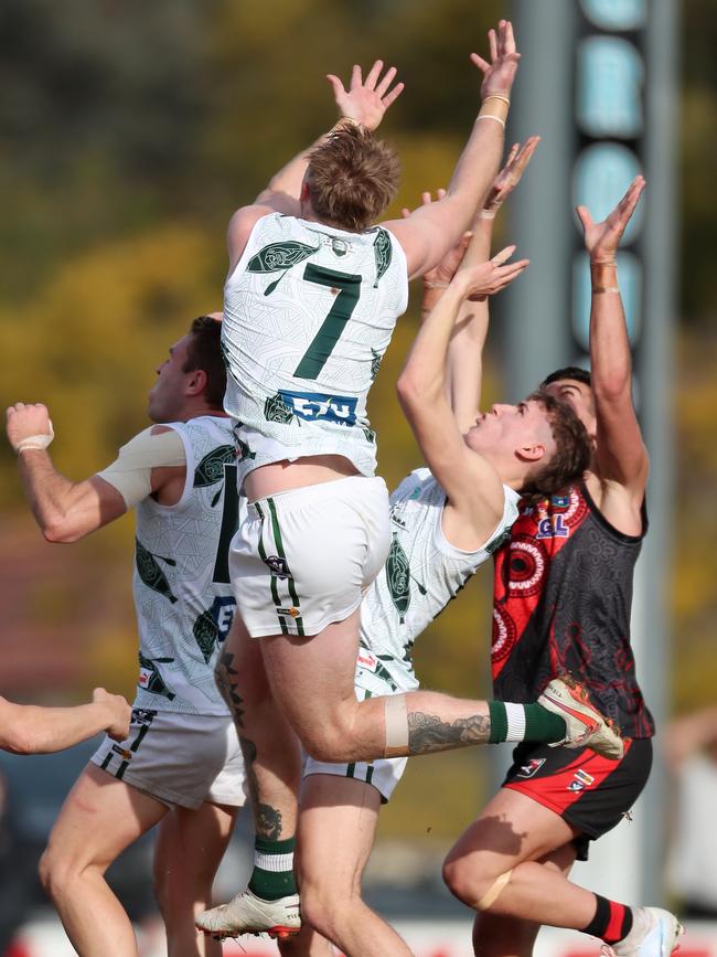 Echuca players Logan Prout, Cameron Valentine and Aiden Mills outnumber their Kyabram opponent.