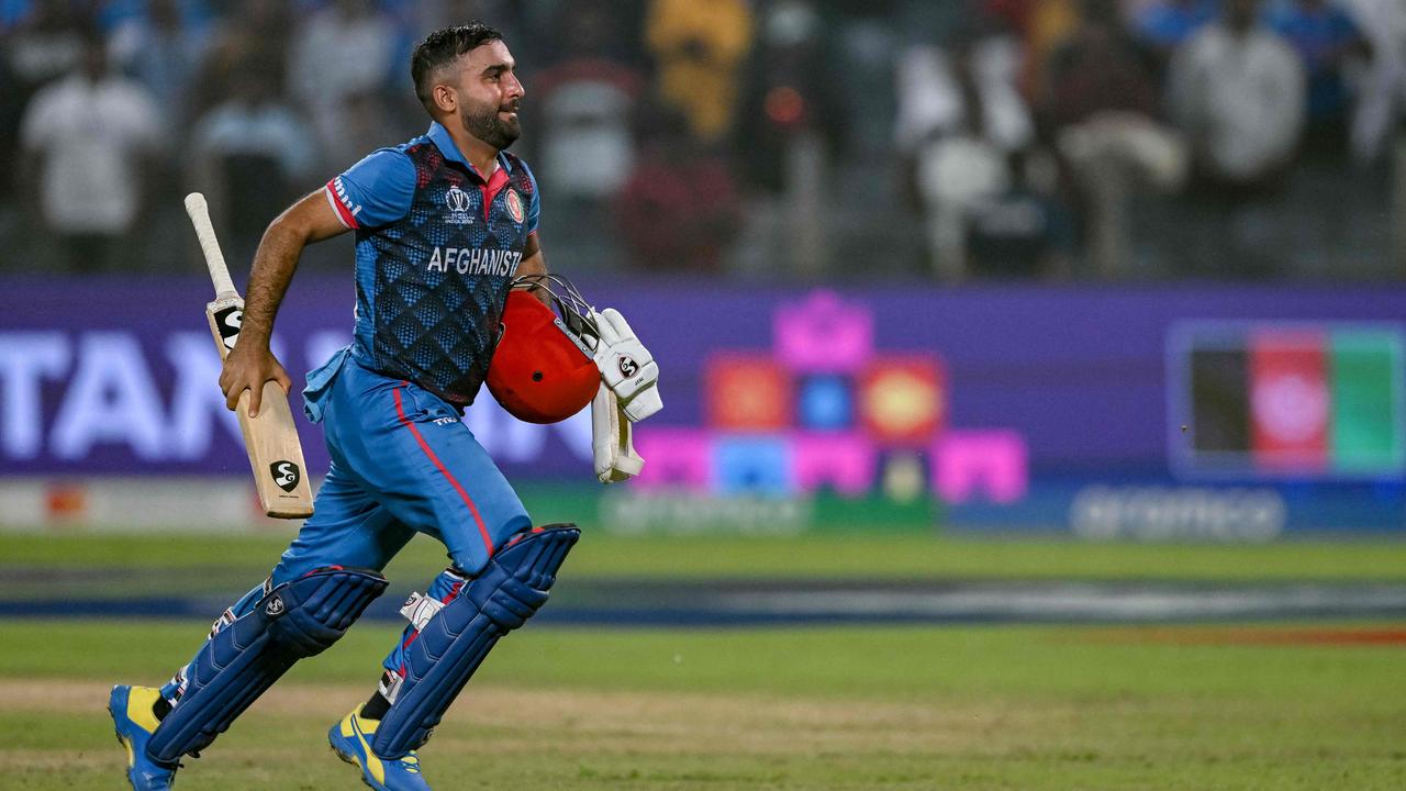 Afghanistan's captain Hashmatullah Shahidi runs off the field after winning the match.