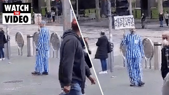 Man dressed in Nazi concentration camp uniform