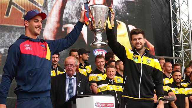 Captains Taylor Walker of the Crows and Trent Cotchin of the Tigers show the Premiership Cup to the crowd during the 2017 AFL Grand Final Parade.