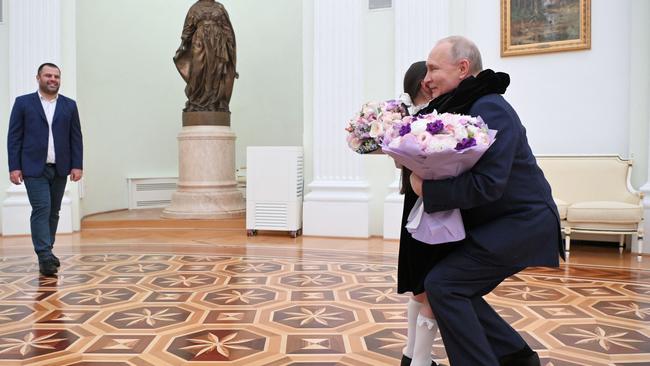 Russian President Vladimir Putin meets with Raisat Akipova, an 8-year-old girl from Derbent, at the Kremlin in Moscow. Picture: AFP