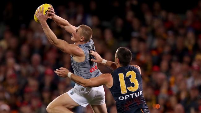 Tom Clurey of the Power outmarks Taylor Walker. Picture: James Elsby/AFL Photos via Getty Images