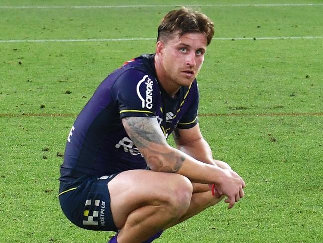 BRISBANE, AUSTRALIA - SEPTEMBER 25: Cameron Munster and Harry Grant of the Storm looks dejected after defeat during the NRL Preliminary Final match between the Melbourne Storm and the Penrith Panthers at Suncorp Stadium on September 25, 2021 in Brisbane, Australia. (Photo by Bradley Kanaris/Getty Images)