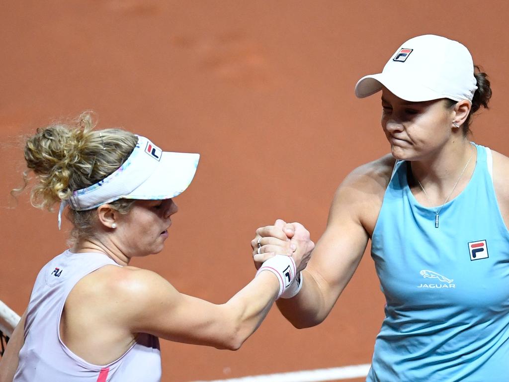 Ashleigh Barty and Laura Siegemund shake hands.