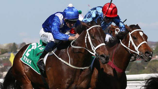 Winx and Hugh Bowman take charge in the Turnbull Stakes. Picture: Michael Klein