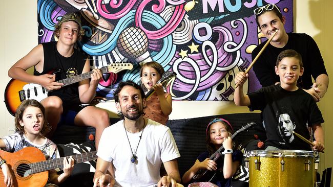 Darcy Dickenson, 14, Cooper Davis, 21, Harry Perrin, 9, Sunny Hagiaglou, 3, Zara Perrin, 7, Noah Power, 9, and Costa Hagiaglou. Local music teacher Costa Hagiaglou has relocated his music school to Denham Street, North Ward from his home. PICTURE: MATT TAYLOR.