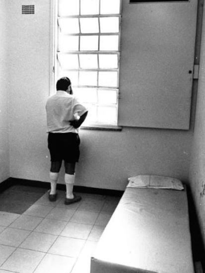 A man stares out of the window of one of the single security wards at Gladesville Hospital. Picture: David Mott